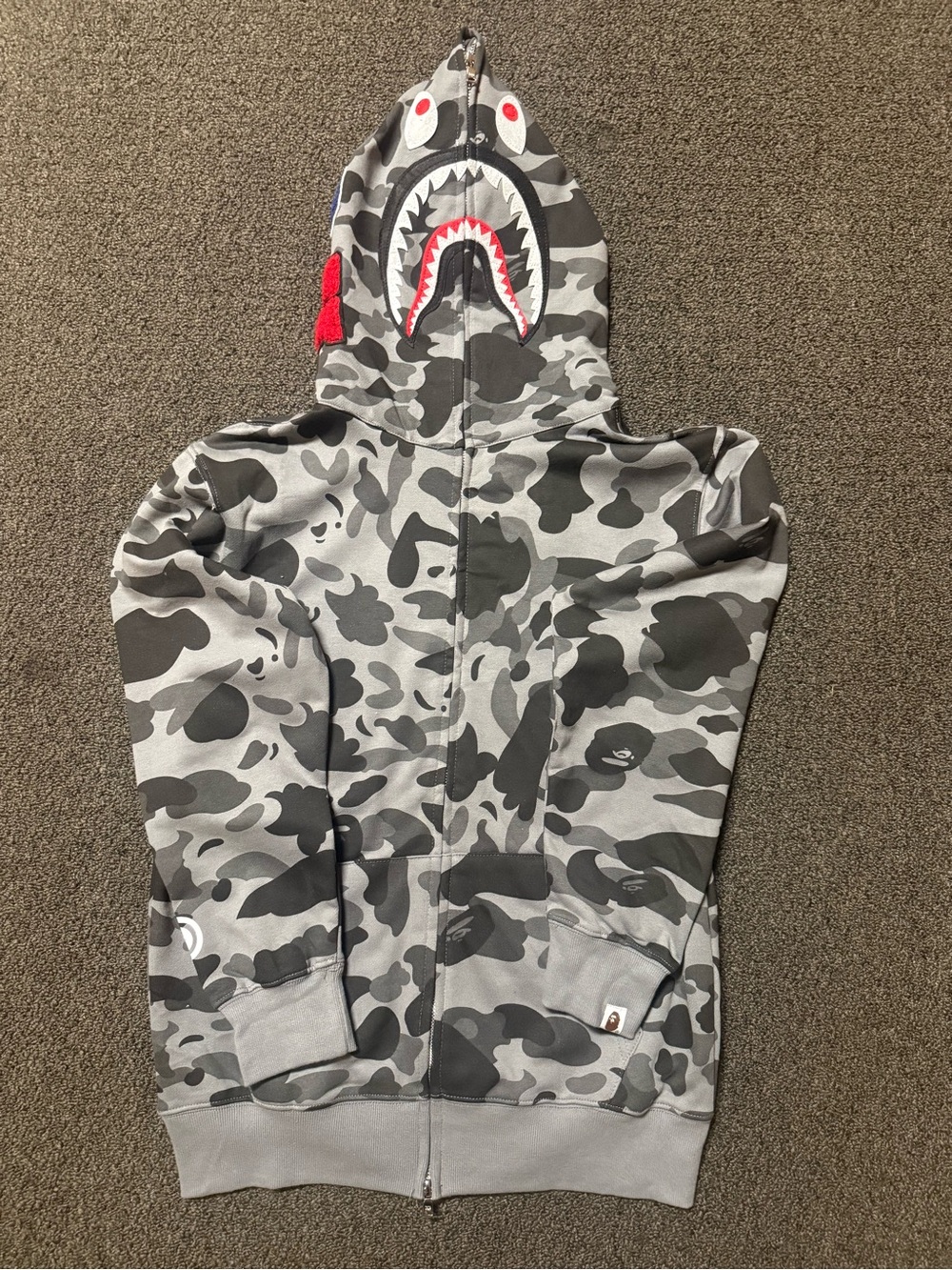 Bape Kids Gray Camo Zip Hoodie with Colorful Lettering